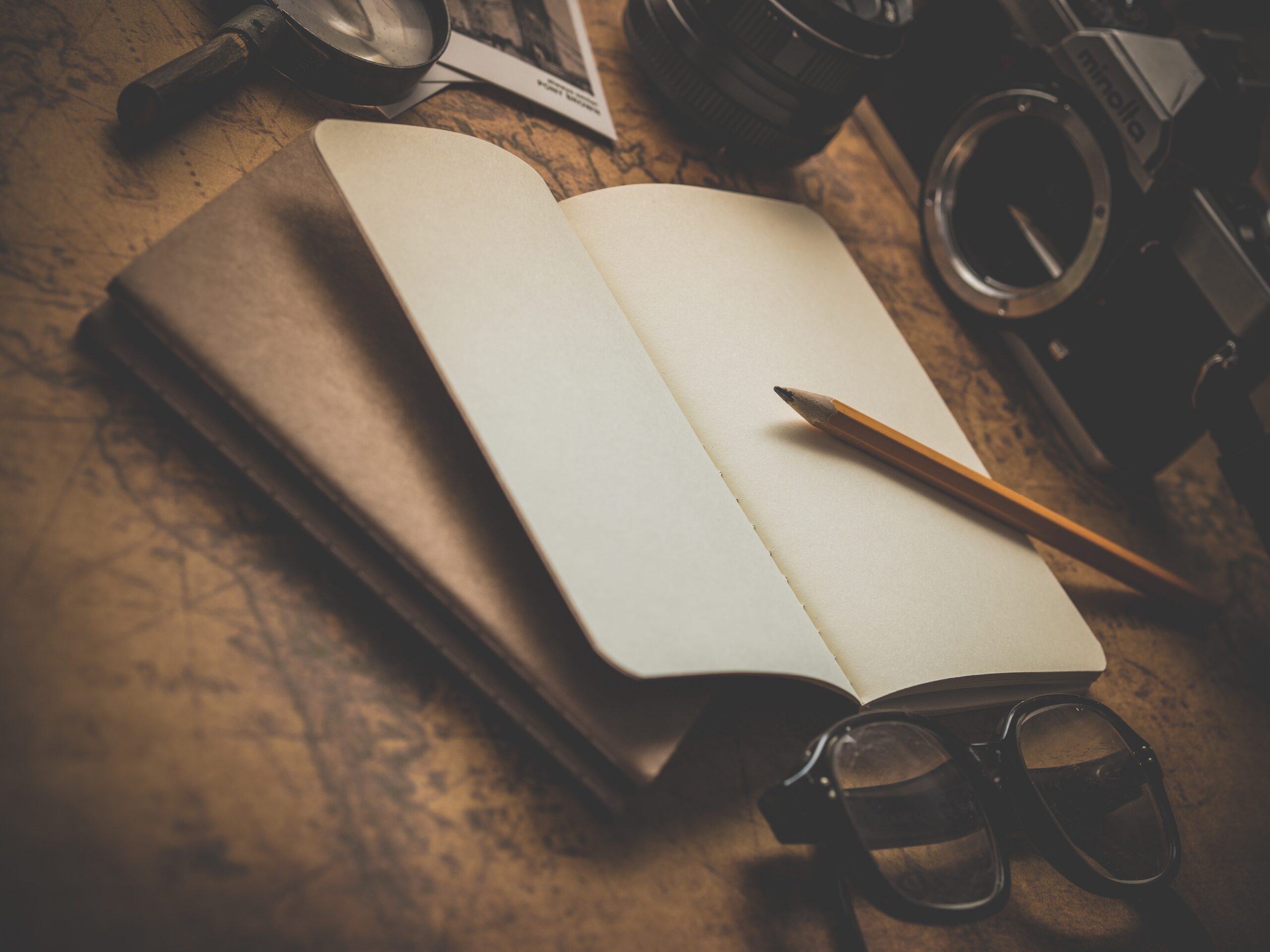 Notebook on a desk with pencil